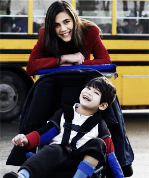 mother and son in wheelchair smiling